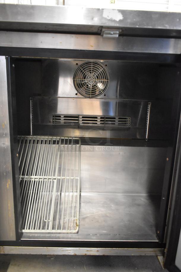 Turbo Air TWR-72SD-N stainless steel 3-door work top cooler interior, visible fan and shelving, commercial casters, 115V, 1 Phase.