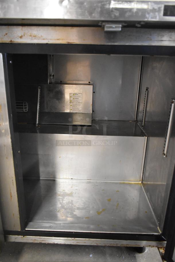 Turbo Air TWR-72SD-N stainless steel 3-door work top cooler, interior view, on commercial casters. 115V, 1 Phase.
