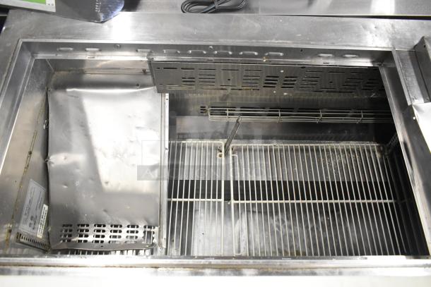 Turbo Air TWR-72SD-N stainless steel prep table, interior view, shows open compartments, model MST-72-30-N tag visible.