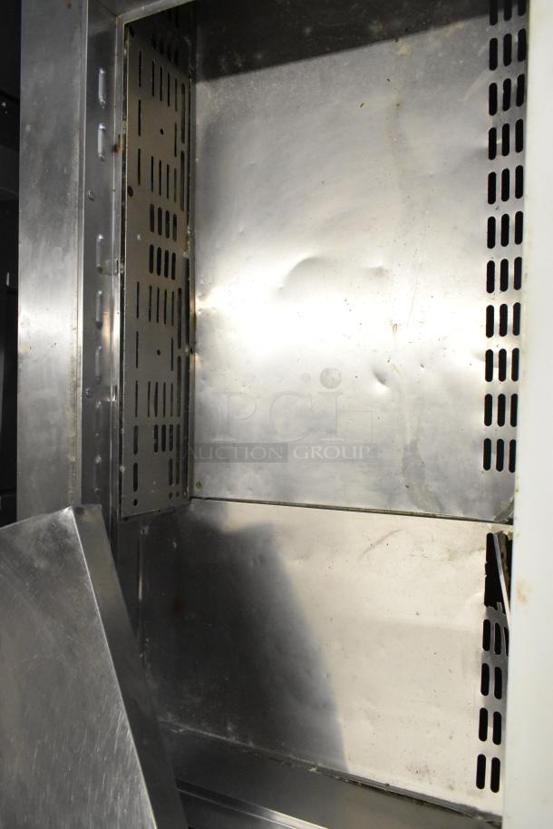 Turbo Air TWR-72SD-N stainless steel prep table interior, showing shelf brackets and smooth surfaces, model MST-72-30-N.