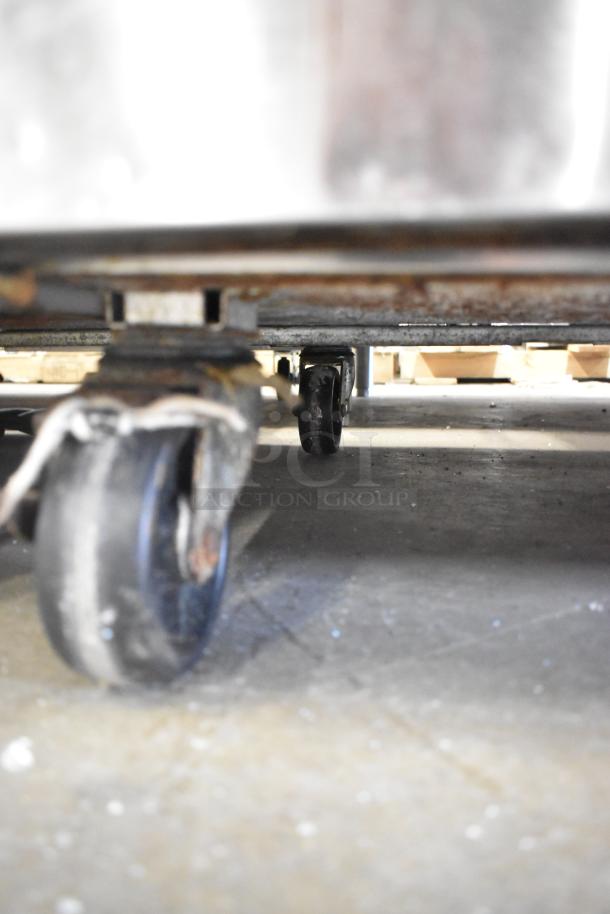 Turbo Air MST-72-30-N stainless steel prep table on commercial casters, showing base and wheels. Model TWR-72SD-N.