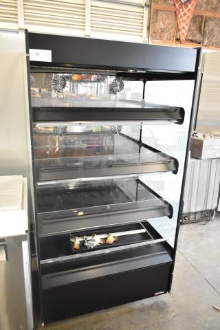 Flexeserve FXZNA10S4S-ST61 metal floor style heated merchandiser, 4 shelves, 208 volts, 1 phase, excellent condition.