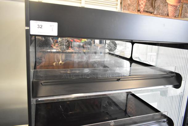 2024 Flexeserve FXZNA10S4S-ST61 heated merchandiser, metal floor style, reach-in grab-n-go, 208V, 1 phase, excellent condition.