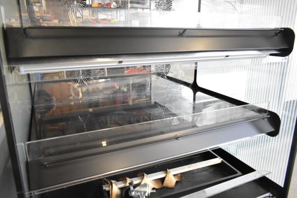 2024 Flexeserve FXZNA10S4S-ST61 heated merchandiser, reach-in style, metal build, shelving visible, 208 volts, 1 phase.