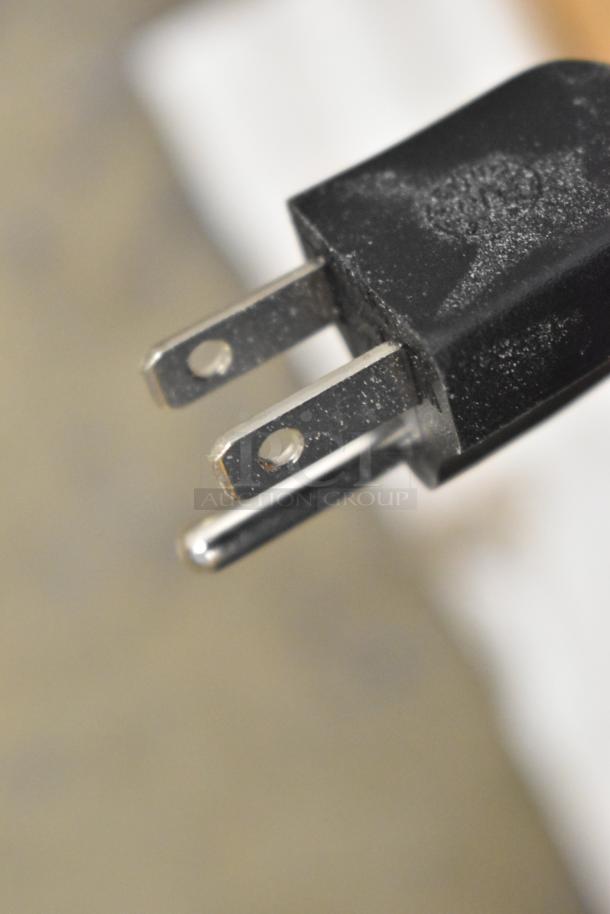Close-up of a black electrical plug for the Hoshizaki KM-81BAJ ice maker. 115 volts, 1 phase.