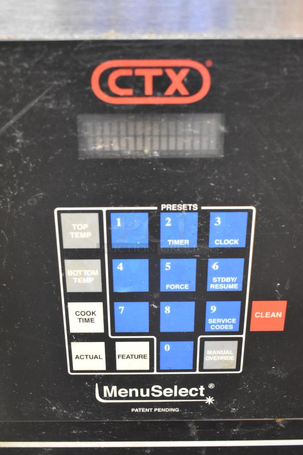 Middleby Marshall CTX DZ33I control panel with preset buttons for temperature and timer. Features stainless steel casing.