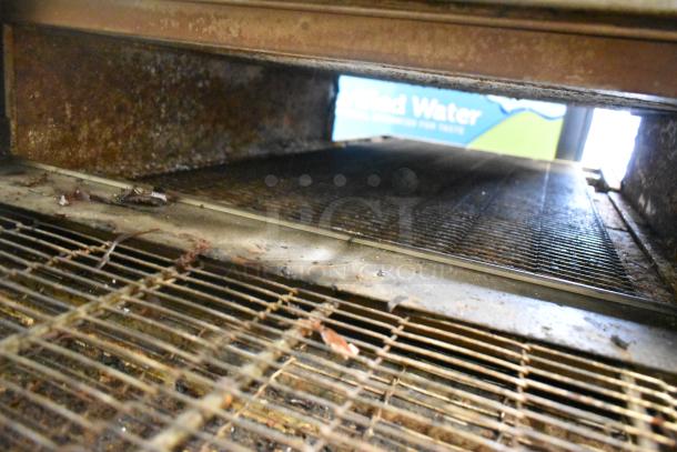 2 Middleby Marshall CTX DZ33I pizza ovens, stainless steel, electric, commercial casters, visible internal wear.