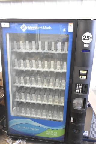 Crane 5800-4 metal vending machine for bottled drinks, features a bill acceptor, 25-cent cost, 115 volts, 1 phase, good condition.