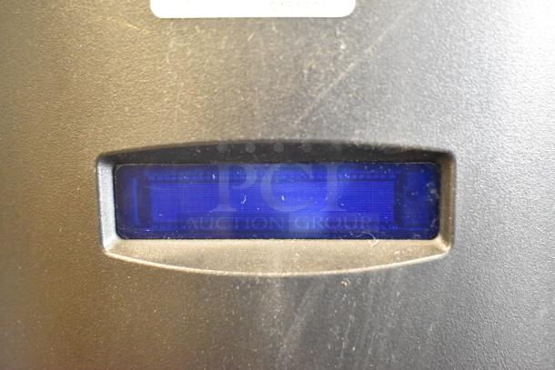 Crane 5800-4 vending machine display close-up. Metal exterior, bill acceptor feature, operational condition.