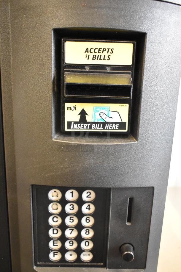 Crane 5800-4 metal drink vending machine with bill acceptor. Features keypad, accepts $1 bills. 115V, 1 phase.
