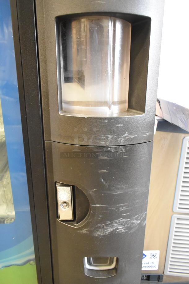 Crane 5800-4 metal commercial drink vending machine, features bill acceptor, visible surface wear, 115 volts, 1 phase.