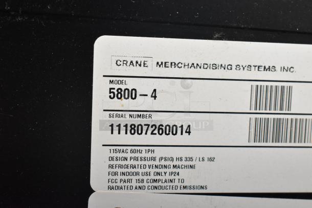 Crane 5800-4 vending machine label; model, serial number, 115VAC, 1 phase details, and indoor use notes visible.