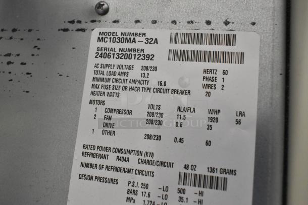 2024 Scotsman MC1030MA-32A stainless steel ice machine label, showing model and voltage details, in good condition.