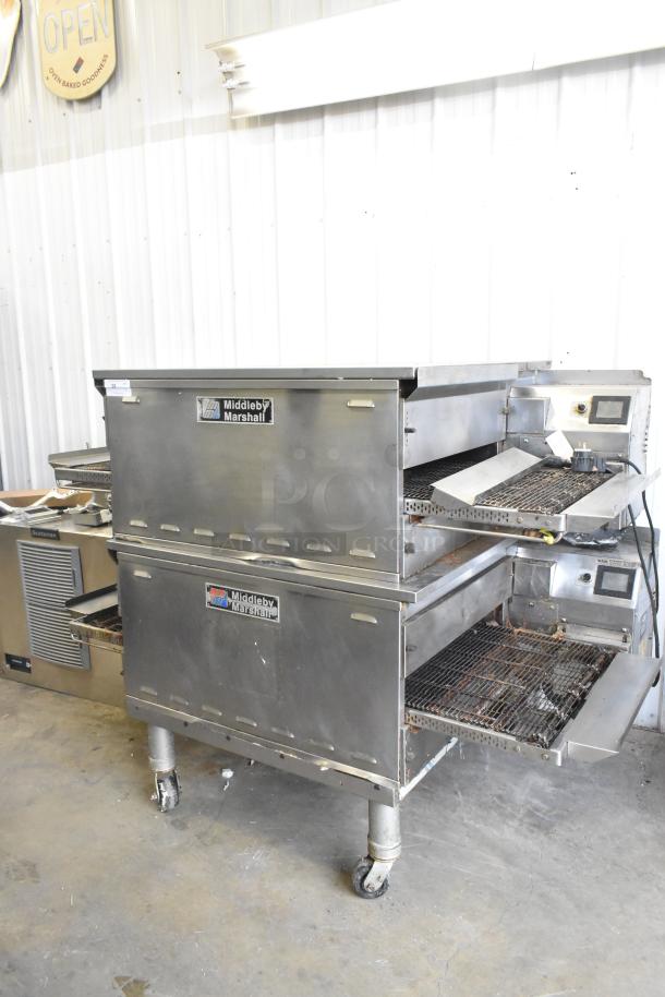2 Middleby Marshall PS638G stainless steel conveyor pizza ovens, natural gas, 89,000 BTU, on commercial casters, used condition.
