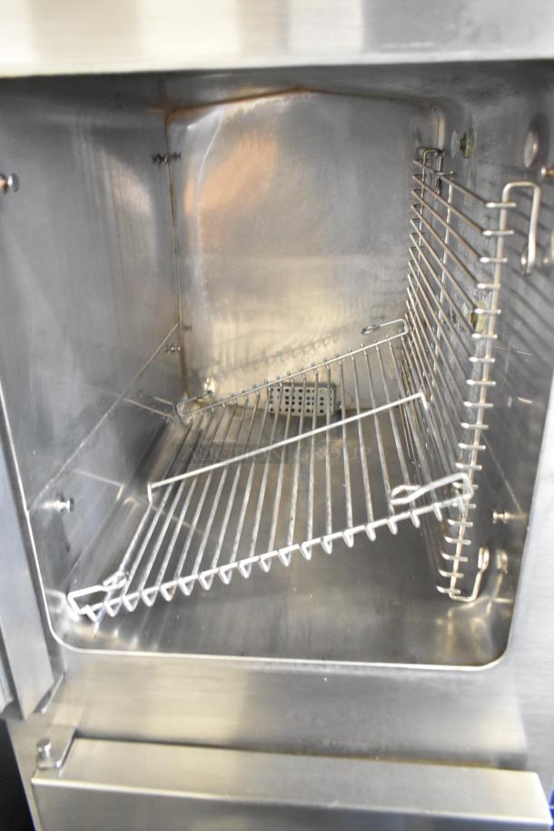 Cleveland SteamCraft Ultra 10 stainless steel commercial steam cabinet interior view, showcasing racks and clean condition.