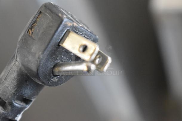 Close-up of a plug for Continental 1FE Stainless Steel Commercial Single Door Reach-In Freezer. 115 Volts, 1 Phase.