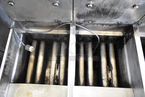 Pitco Frialator stainless steel gas-powered 4 bay deep fat fryer on commercial casters, showing heating elements and wiring.