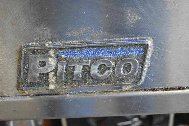 Pitco Frialator stainless steel label on commercial gas-powered 4-bay deep fat fryer, indicating brand and make.