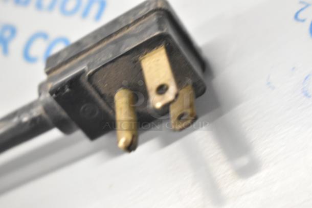 Plug of Perlick DDS36 beer dispenser. Close-up showing prongs and wiring. Item is brand new with scratches and dents.