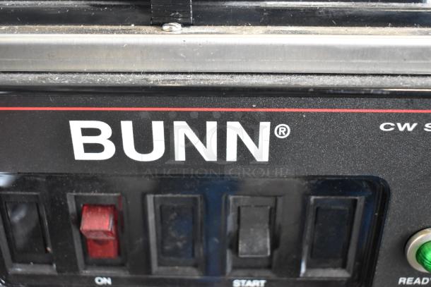 Bunn CWTF15-APS coffee machine panel with power switches, brand logo, and markings. Stainless steel, 120V, 1 Phase.