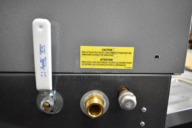 BRAND NEW SCRATCH AND DENT! Hatco metal commercial water heater, caution label visible, Apollo valve handle, sturdy condition.