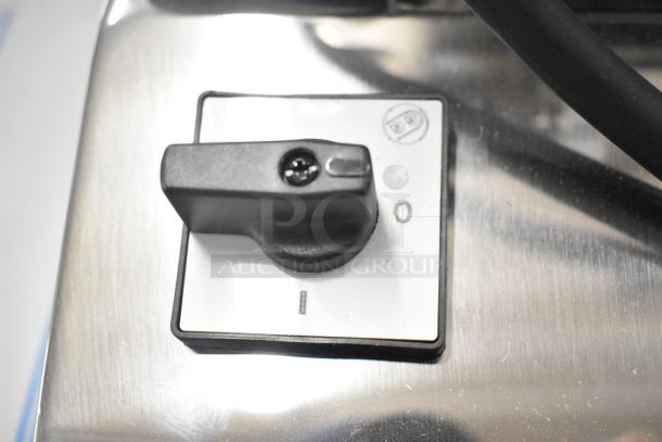 BRAND NEW Pavoni Newcookmatic V1 pastry press. Stainless steel, 110 volts, 1 phase. Visible control knob on stainless surface.