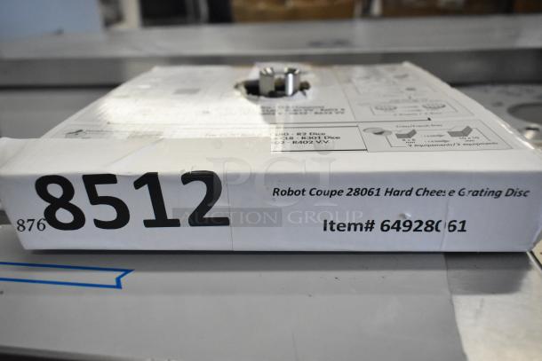 The image shows a boxed Robot Coupe 28061 hard cheese grating disc, item number 64928061, partially open on one side.