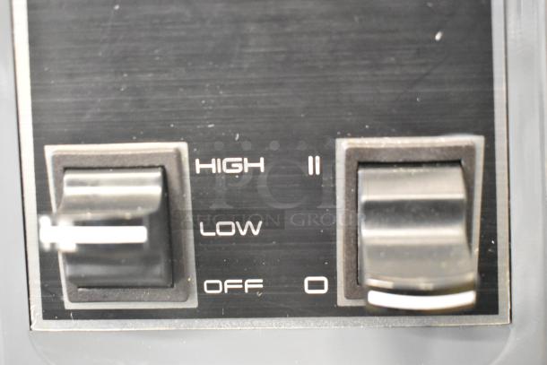 Close-up of the AvaMix 928BL2T48 blender toggle control, showing settings "High," "Low," and "Off" on a black panel.