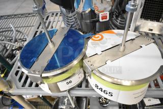 Brand new stainless steel popcorn kettle for merchandiser, with scratch and dent condition. Includes labels showing inventory numbers 56 and 8465.