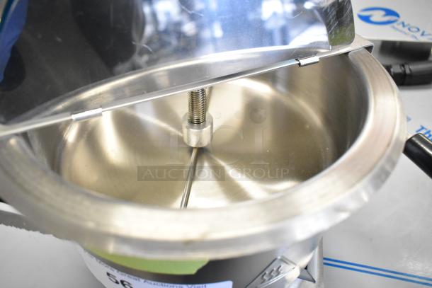 Stainless steel popcorn kettle, brand new, scratch and dent condition, for popcorn merchandiser; includes lid and stirring mechanism.