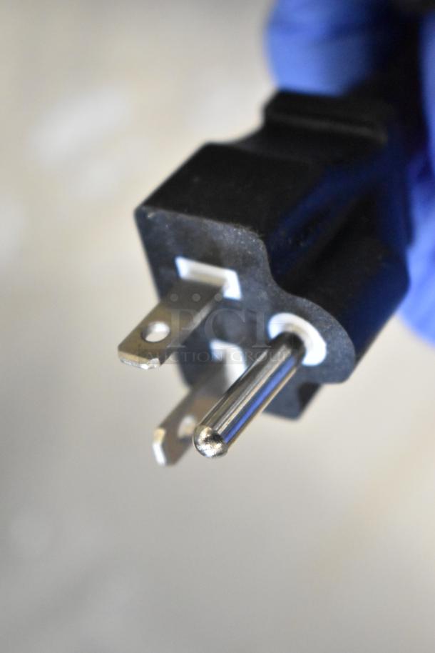 Close-up of a power plug end, likely for the Avantco 177EG24N electric griddle, showcasing plug prongs for 208/240 volt use.