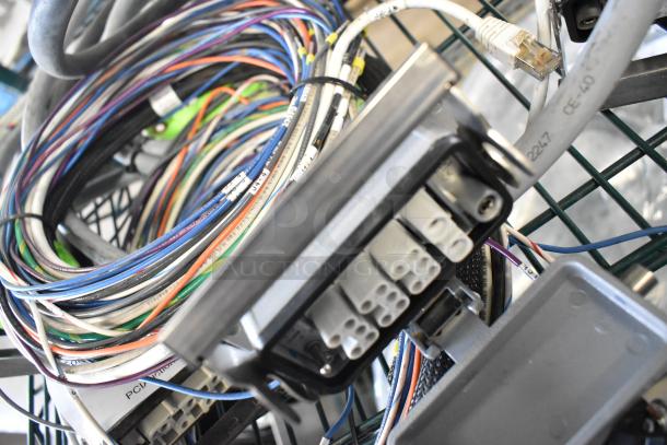 Lot of various wires and connectors, including multicolored cables, Ethernet plugs, and labeled wiring, all in used condition.