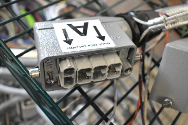 Gray electrical connector with four ports and visible wiring, labeled "Match color and letter." Auction includes 14 varied items.