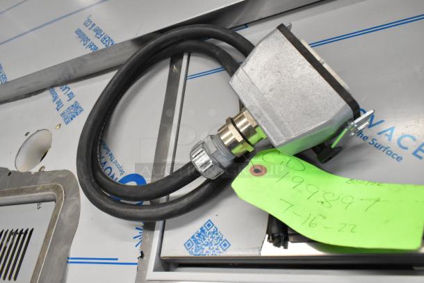 Bundle of 14 various items, including a heavy-duty electrical connector with attached black cable. Green tag labeled "CID 199897 7-16-22."