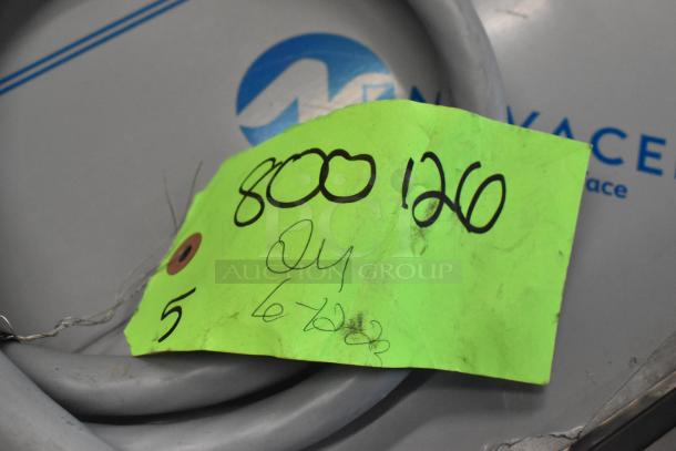 Bundle of various items including wires, labeled with handwritten notes on a bright green tag indicating item number 800 126.