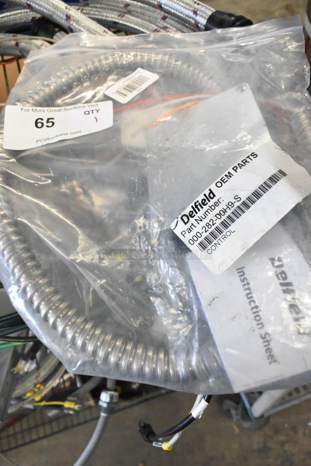 Brand new Delfield 000-282-00H9-S Control Kit, OEM parts in sealed packaging, part number visible, minor packaging wear.