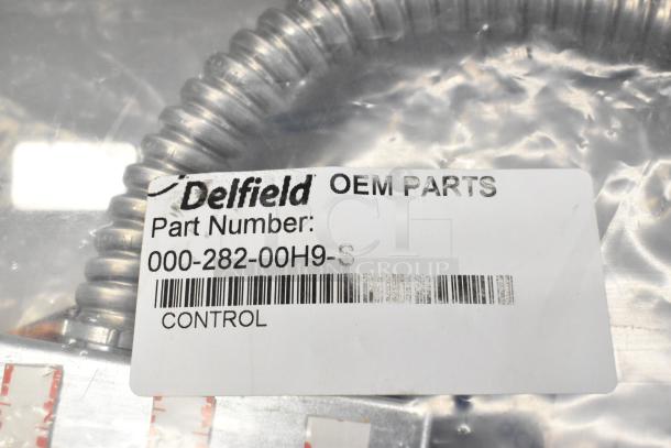 Brand new Delfield control box kit, part number 000-282-00H9-S, OEM parts label visible in packaging.