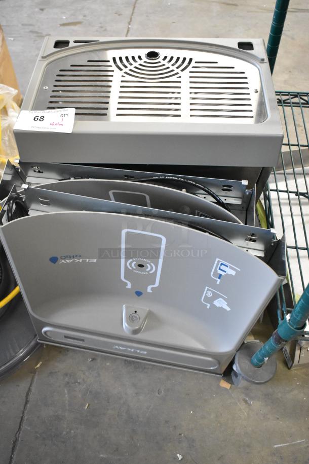 Brand new Elkay water bottle filler with drip tray, slight scratches; includes activation sensor and installation components.