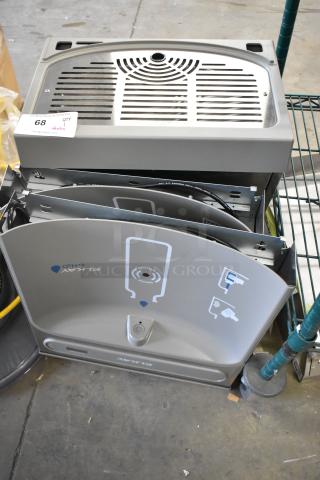 Brand new Elkay water bottle filler with drip tray, slight scratches; includes activation sensor and installation components.