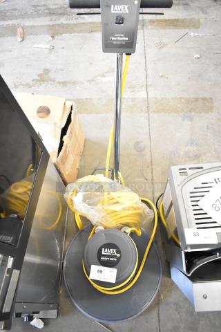 Lavex TP-2015 heavy-duty floor cleaning machine, brand new, with minor scratches and dents. 120V, 1 phase, yellow cord wrapped.