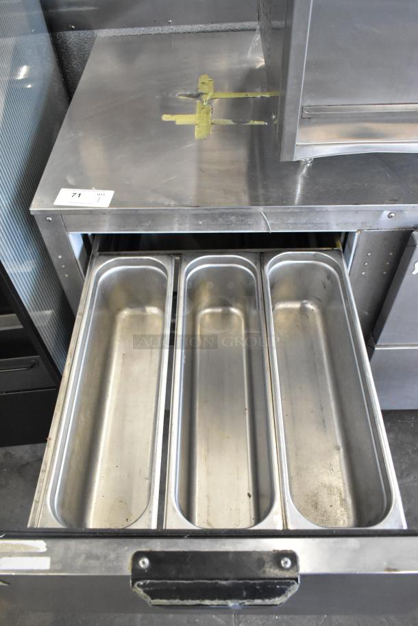 Beverage Air UCRD93A-4-23 stainless steel cooler with 4 drawers, 1 door, on commercial casters. 115V, used condition.