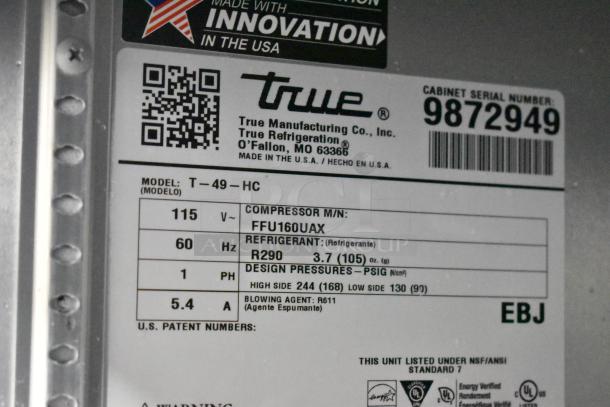 2019 True T-49-HC cooler label showing model, voltage, refrigerant, and design pressures. Serial number 9872949.
