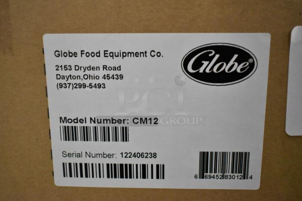Label on Globe CM12 meat chopper box, showing model number, serial number, and Globe Food Equipment Co. contact details.