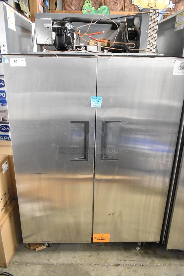 2024 True TG2R-2S-HC stainless steel commercial 2-door reach-in cooler, 115V, door needs reattachment, poly-coated racks.