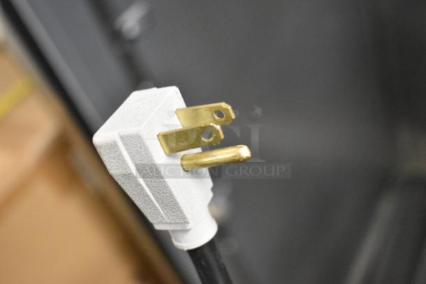 2024 True TG2R-2S-HC stainless steel cooler plug. Needs door reattachment. 115V, 1 phase. Poly coated racks included.