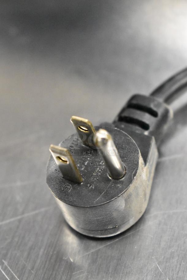Close-up of the plug for the 2021 Delfield 406P-STAR4 stainless steel undercounter cooler, 115V, 1 phase.