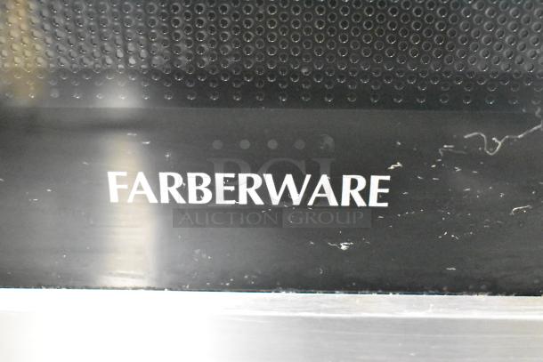 2022 Farberware FMO07AHTBKJ countertop microwave, metal finish. Visible Farberware logo. 120V, 1 Phase.