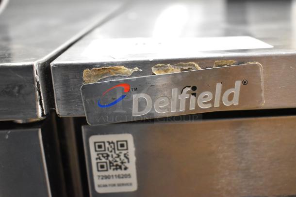 2017 Delfield 406P-STAR2 stainless steel commercial cooler, single door, 115V, showing worn branding label.