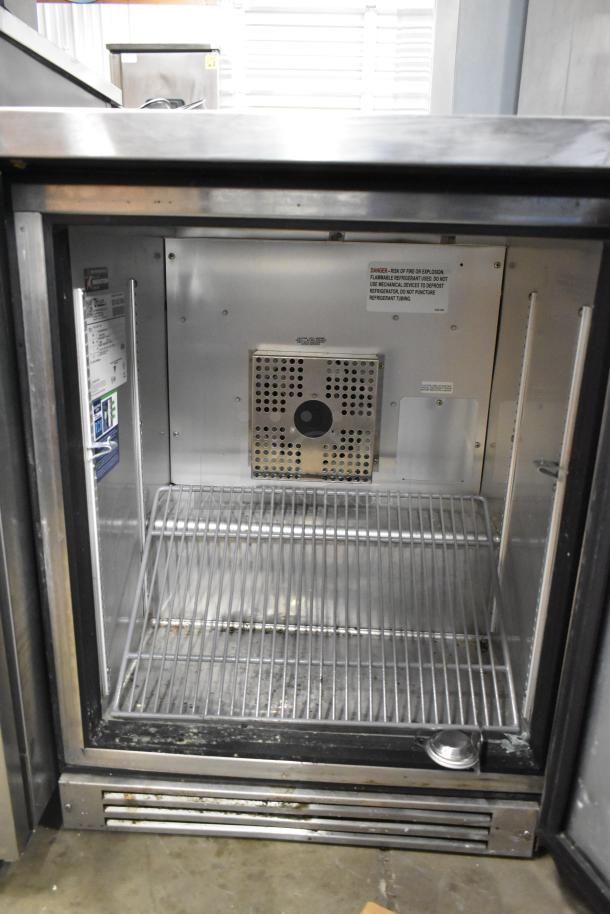True TUC-24F-HC stainless steel undercounter freezer, 115 volts, 1 phase, single door, interior view showing shelving.