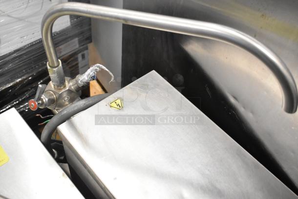 Cleveland KGL-40-T stainless steel 40-gallon steam kettle, 140,000 BTU, with valve and electrical warning label visible.